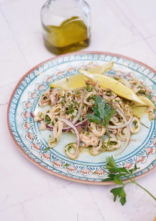 Calmars confits à l’huile d’olive, ail rôti et zestes de citron confit