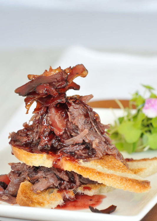 Crostini de canard confit au caramel de fruits rouges