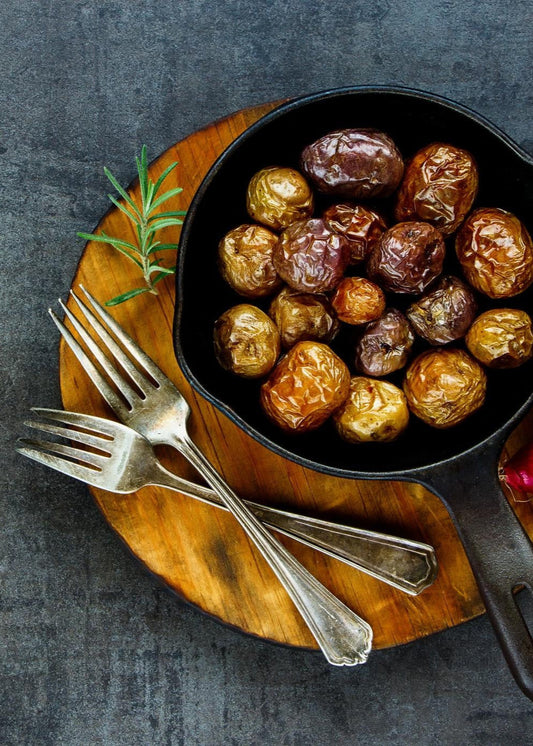 Pomme de terre grelots confites aux gras de canard, à l'ail et aux herbes fines