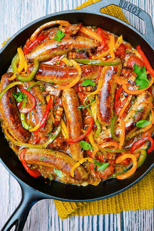 Saucisse toulouse à la piperade aux lardons