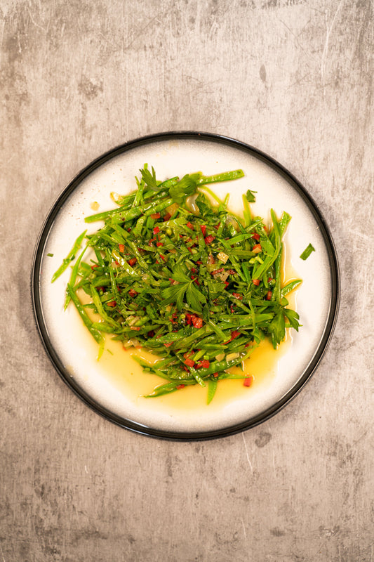 Émincé de pois mange-tout sauté au beurre et citron confit