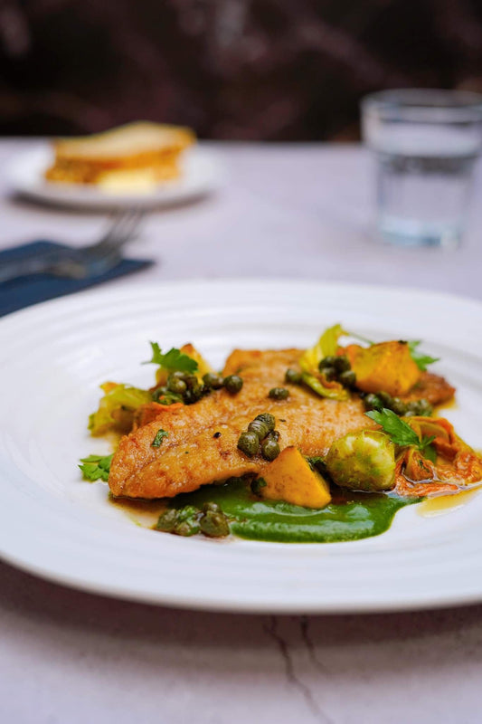 Filet de sébaste poêlé, crème d’épinards à l’ail confit