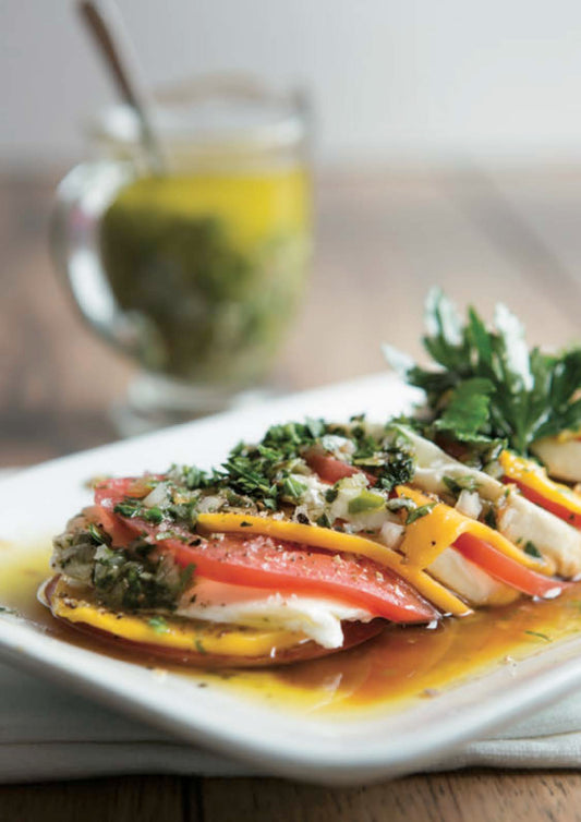 Mozzarella di Bufala à la tomate, mangue et persillade